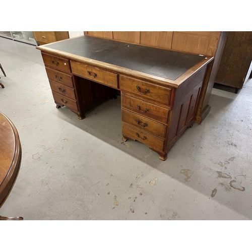 99 - Edwardian mahogany stained nine drawer twin pedestal desk with brass drop handles. Approx. 66ins. x ... 