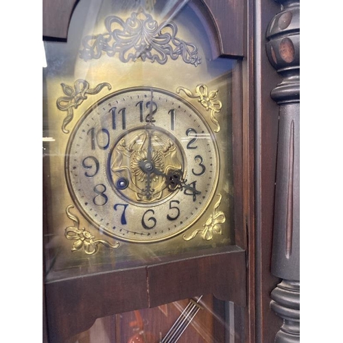 120 - Clocks: Art Nouveau regulator with brass face and stylised spandrels. 43ins.