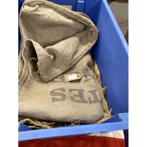 137 - French postal sack together with four flags and three coffee sacks.