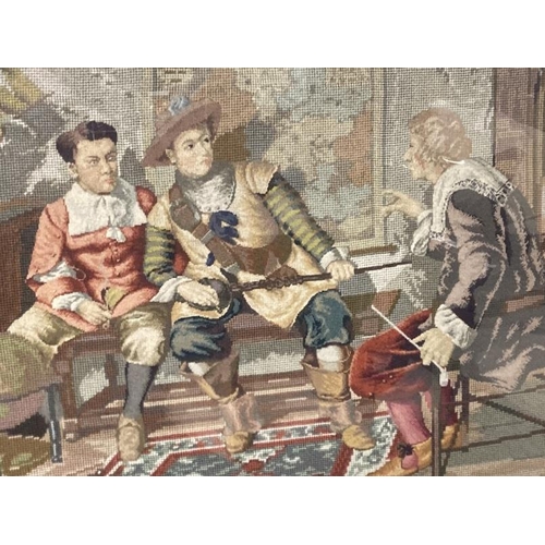 158 - 19th cent. Woolwork tapestry, three figures, one holding fish in an interior. Framed and glazed. 31i... 