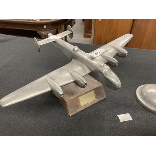256 - Collection of three aluminium models of aircraft on stands including a Lancaster and Stuka. (3)
