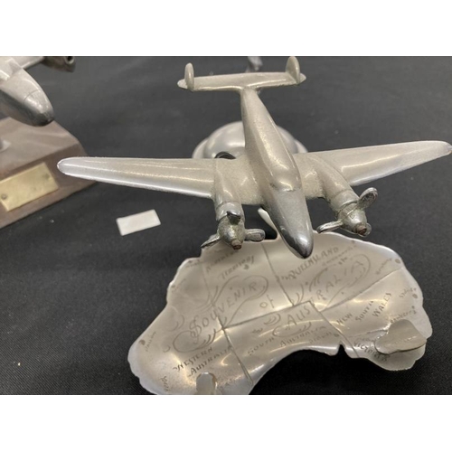 256 - Collection of three aluminium models of aircraft on stands including a Lancaster and Stuka. (3)