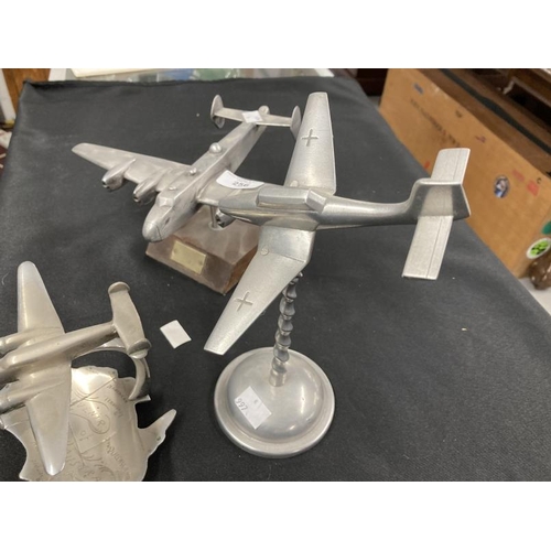 256 - Collection of three aluminium models of aircraft on stands including a Lancaster and Stuka. (3)