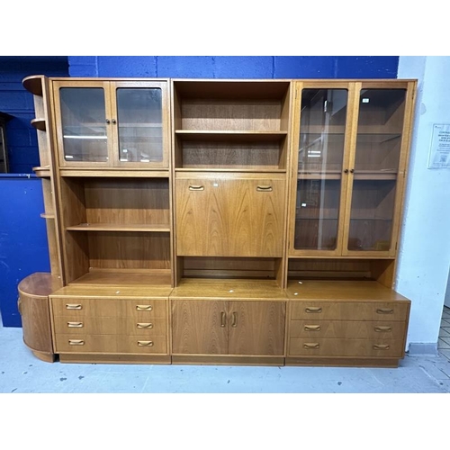 1 - Mid 20th cent. G-Plan teak effect wall units including glazed display cabinet over three drawers, ba... 