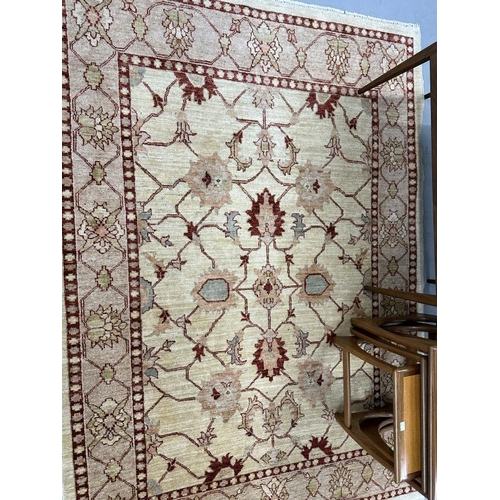 23 - Rugs & Carpets: Modern weave rug, ivory colour highlighted with reds, blues and green. 81ins. x 58in... 