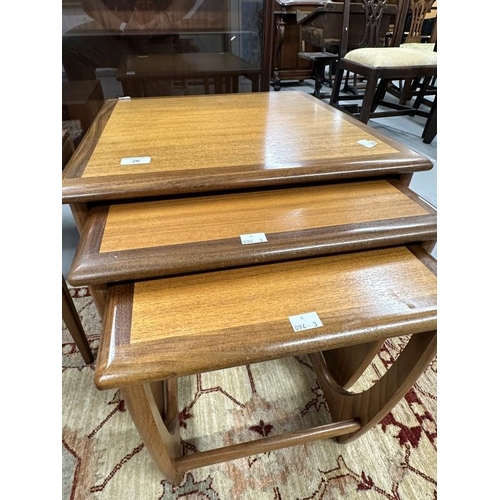 26 - Mid 20th cent. G-Plan teak effect three table nest of tables. The largest 19½ins. x 19½ins. x 20ins.