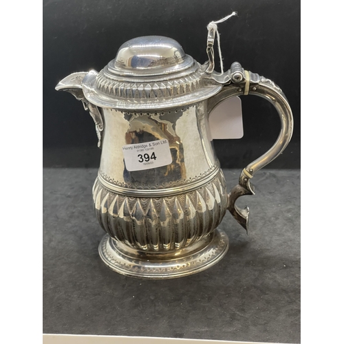 394 - Georgian Hallmarked Silver: Lidded jug with reed pattern handle, lid with scroll handle, ivory insul... 