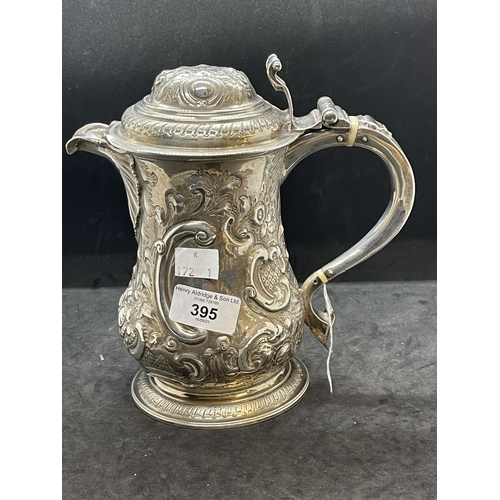 395 - Silver & Plated Ware: George III white metal lidded jug with embossed floral decoration and having a... 