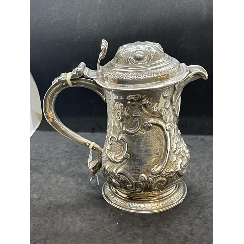 395 - Silver & Plated Ware: George III white metal lidded jug with embossed floral decoration and having a... 