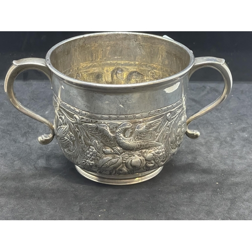 396 - Silver & Plated Ware: George II white metal two handled loving cup with embossed swan decoration, ha... 