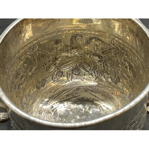 396 - Silver & Plated Ware: George II white metal two handled loving cup with embossed swan decoration, ha... 