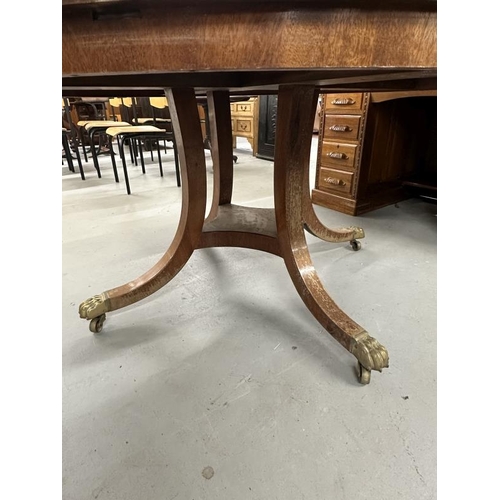 48 - 19th/20th cent. Mahogany circular dining table on splayed supports terminating in brass claw feet an... 