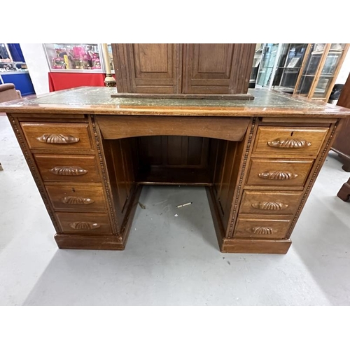 49 - 20th cent. Mahogany double pedestal desk, four drawers either side with carved handles, green leathe... 