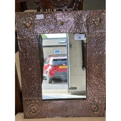 66 - Arts & Crafts beaten copper mirror in the style of Liberty's. 13ins. x 12ins.