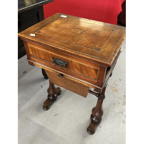 67 - 19th cent. Mahogany sewing table with inlaid oval motif above a drawer for sewing requisites. 18ins.... 