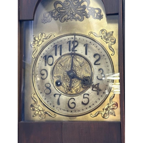 78 - Clocks: Art Nouveau regulator with brass face and stylised spandrels. 43ins.