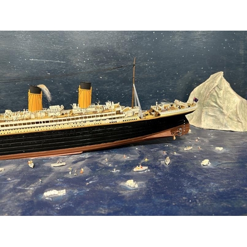 108 - R.M.S. TITANIC: Large diorama depicting the Titanic, iceberg and multiple lifeboats.