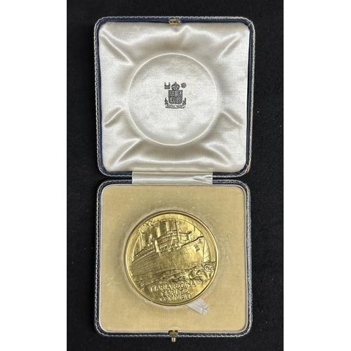 142 - MEDALS/OCEAN LINER: An extremely important 22ct gold Royal Mint presentation medal commemorating the... 