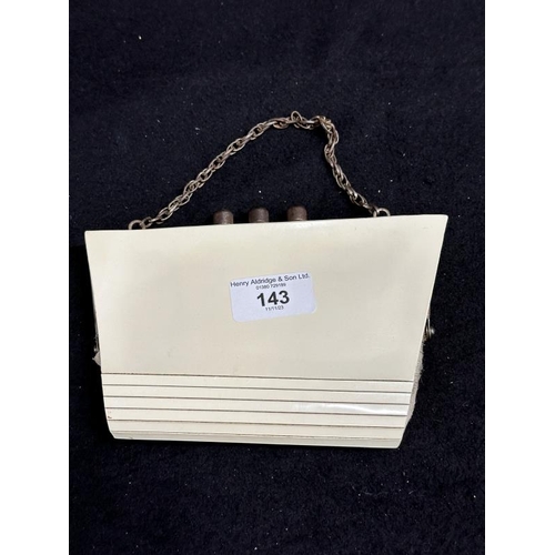 143 - OCEAN LINER/ART DECO: Rare white clutch handbag taking the form of the S.S. Normandie with chromed c... 