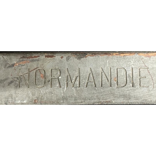 145 - S.S. NORMANDIE: Extremely rare lifeboat nameplate bearing signs of significant exposure to smoke and... 