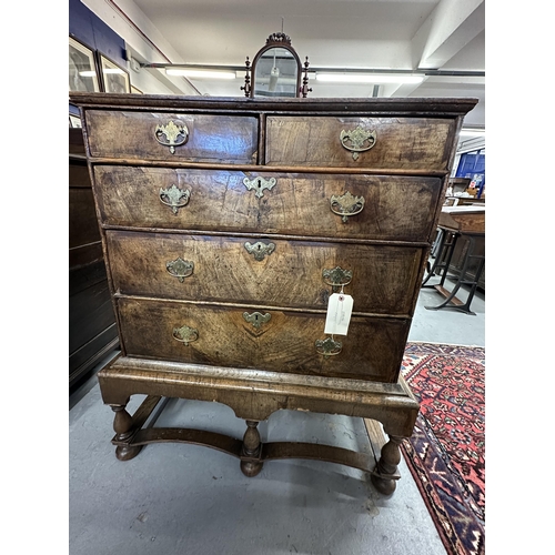 106 - William and Mary/Queen Anne walnut two over three chest of drawers on stand, the drawers with matche... 