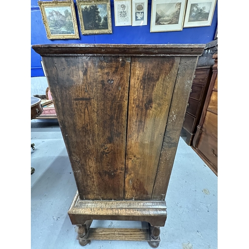 106 - William and Mary/Queen Anne walnut two over three chest of drawers on stand, the drawers with matche... 