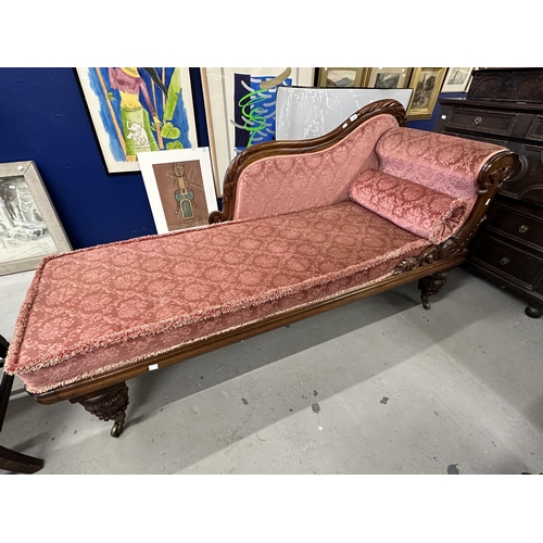 109 - 19th cent. Rosewood chaise lounge, carved back and supports.