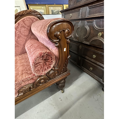 109 - 19th cent. Rosewood chaise lounge, carved back and supports.