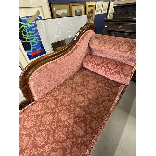 109 - 19th cent. Rosewood chaise lounge, carved back and supports.