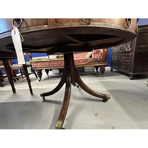 110 - 19th cent. Rosewood drum table with eight drawers, brass lion head handles and leather top on all co... 