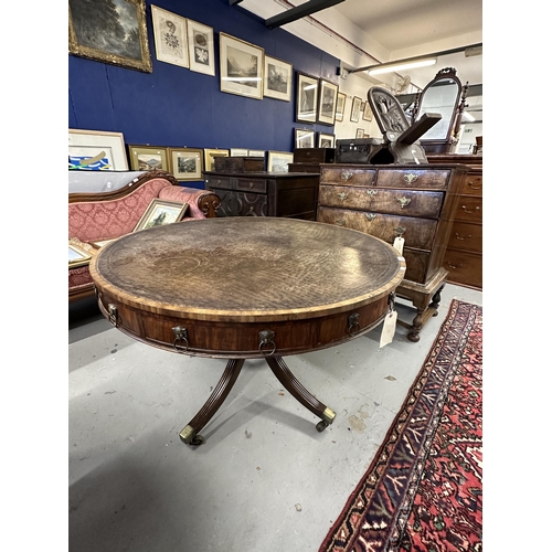 110 - 19th cent. Rosewood drum table with eight drawers, brass lion head handles and leather top on all co... 