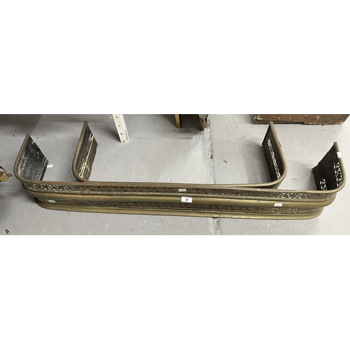 37 - Two brass fire fenders, the larger 47ins. x 7½ins. The smaller 31½ins. x 6ins. Both with piercework ... 