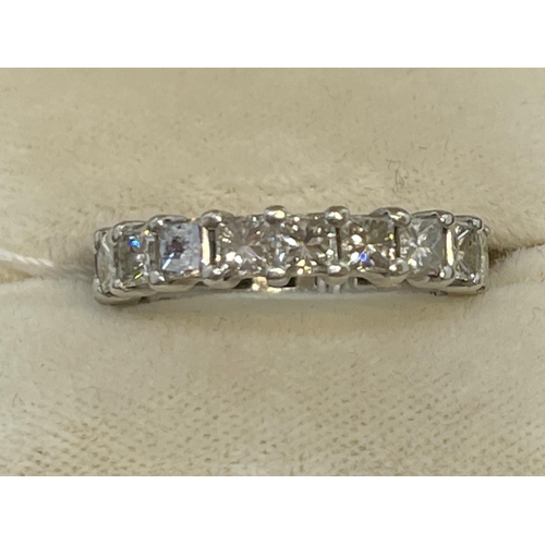 475 - Jewellery: White metal full eternity ring set with nineteen princess cut diamonds, estimated weight ... 