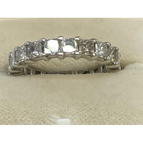 475 - Jewellery: White metal full eternity ring set with nineteen princess cut diamonds, estimated weight ... 