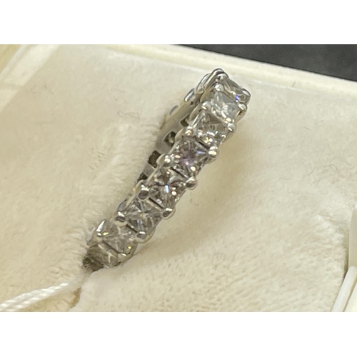 475 - Jewellery: White metal full eternity ring set with nineteen princess cut diamonds, estimated weight ... 