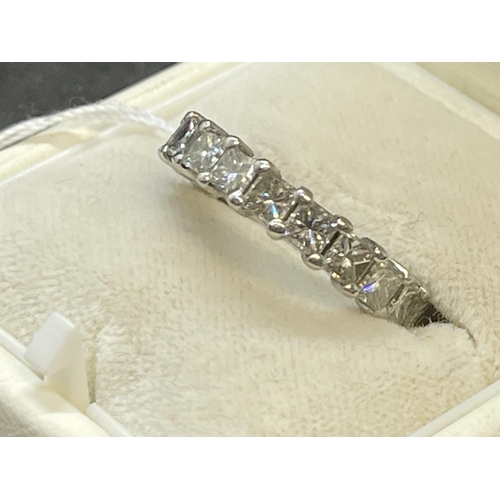 475 - Jewellery: White metal full eternity ring set with nineteen princess cut diamonds, estimated weight ... 