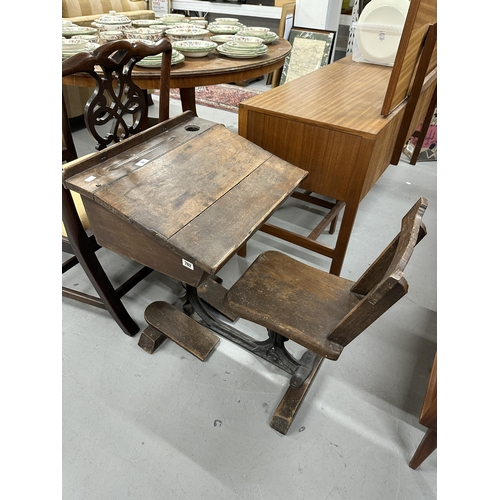 52 - Late 19th/early 20th cent. Oak child's flip top school desk and integrated chair.