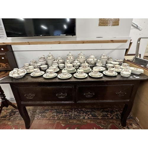 55 - 18th cent. Oak and elm serving table, two wide drawers, on four swept supports.