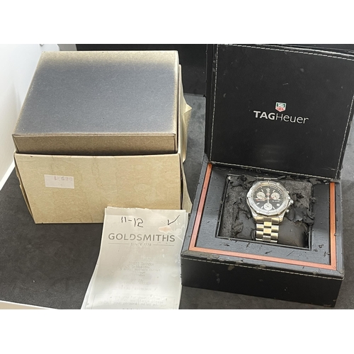 564 - Watches: Tag Heuer Appro 2000 Classic, black face, with box, paperwork and original receipt from Gol... 