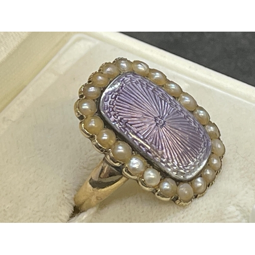 575 - 18ct Victorian mourning rectangular ring 21.5mm x 17.5mm with a lilac coloured enamelled centre surr... 