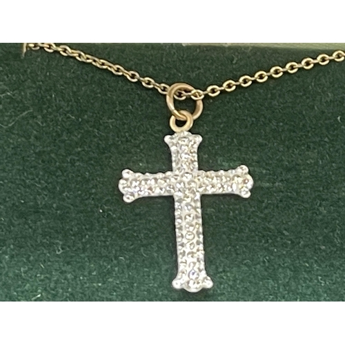 576 - Ladies boxed 9ct gold and white stone Gothic cross, bayonet clasp necklace. Snap and cross are gold,... 