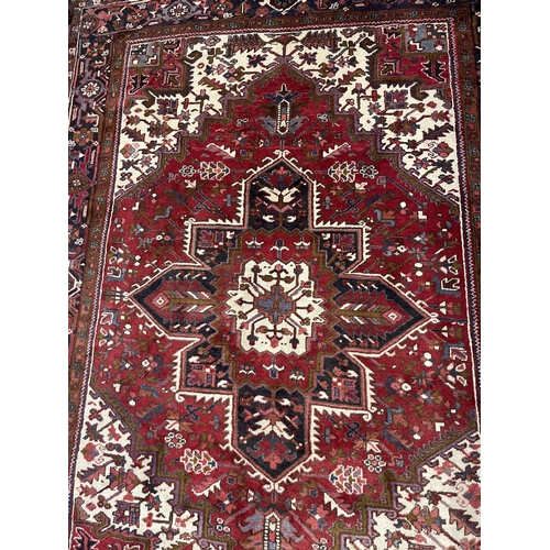 578 - 20th cent. Caucasian carpet, possibly Kazak, red ground with one central Gul, segmented greens, four... 