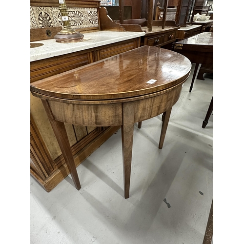 58 - 19th cent. Mahogany demi lune tea table inlaid with boxwood stringing, on tapering supports. 33ins. ... 