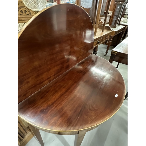 58 - 19th cent. Mahogany demi lune tea table inlaid with boxwood stringing, on tapering supports. 33ins. ... 