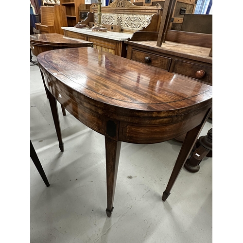 58 - 19th cent. Mahogany demi lune tea table inlaid with boxwood stringing, on tapering supports. 33ins. ... 