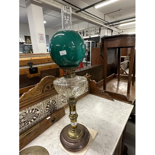 60 - Late 19th/early 20th cent. Pedestal oil lamp, copper base with brass pedestal, clear glass reservoir... 