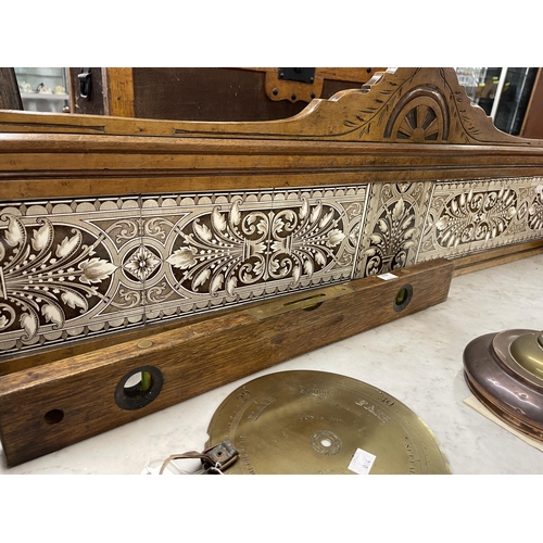 65 - Burr maple marble topped washstand with Minton style tiled splashback. 46ins. x 20ins. x 41ins.... 