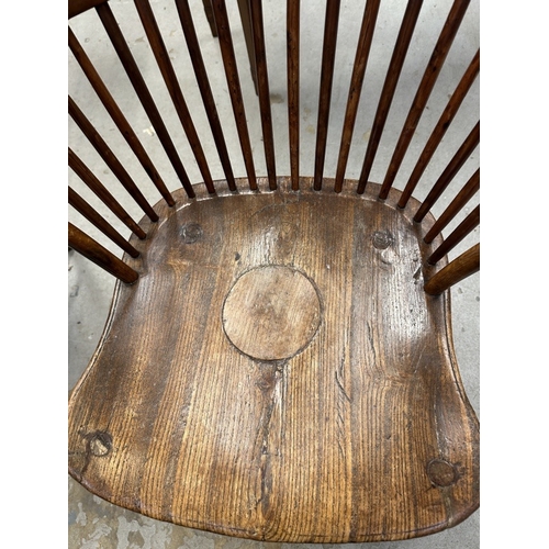 117 - Furniture: 19th cent. Oak and yew hoop back Windsor chair.