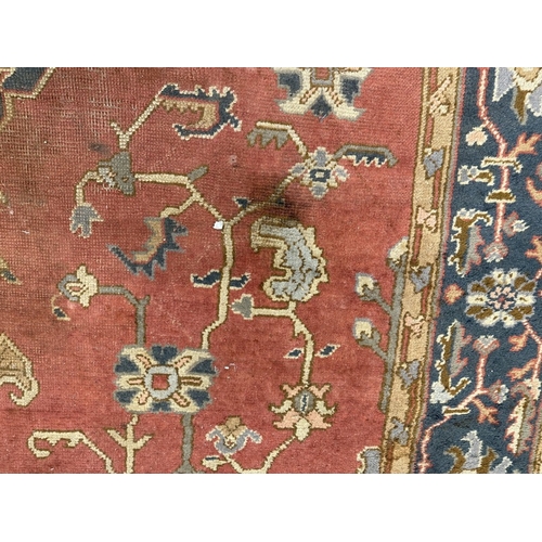 16 - Rugs & Carpets: 19th cent. Iranian Heriz carpet retailed by Maple & Co London (label attached). ... 