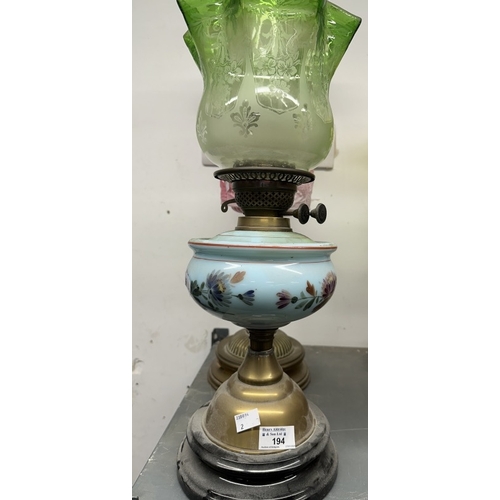 194 - Lighting: 19th/20th cent. Oil lamps both with ceramic reservoirs, the first with a column mount, the... 